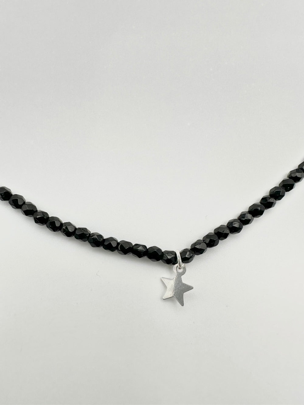 Mon Cajoux 2 en 1 en facettes de bohèmes noir et ça petite breloque étoile en argent massif